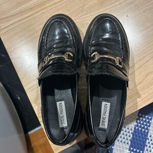 Steve Madden Glossy Black Loafers with Gold Accent